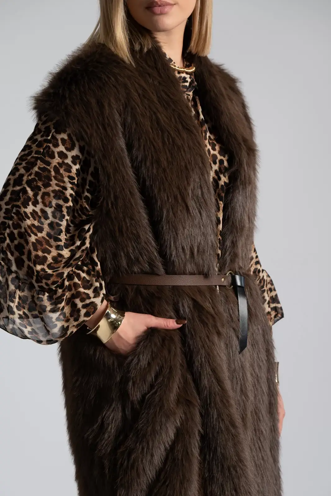 Fur vest with belt outlet